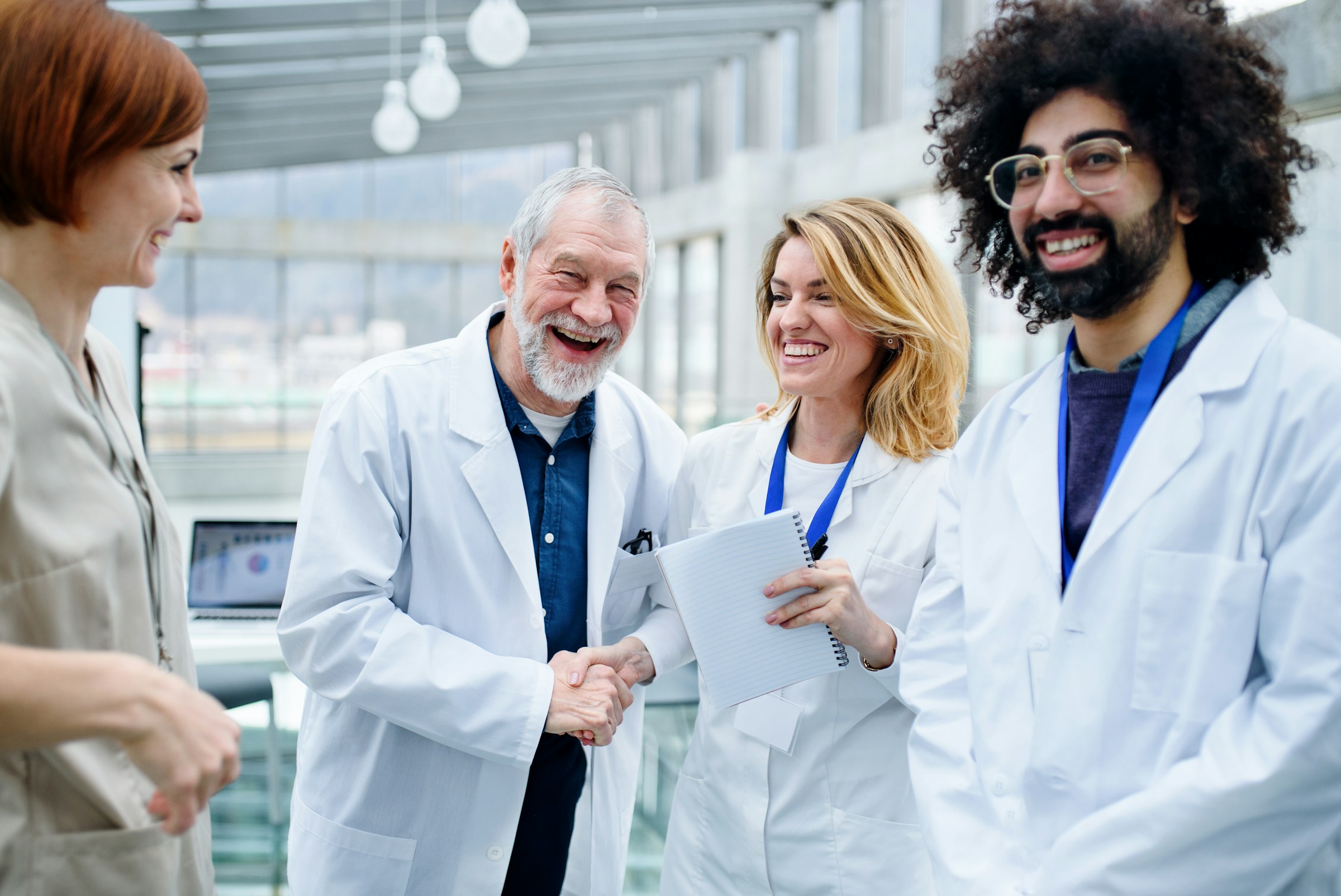 Clinicians greeting a colleague at the start of the day